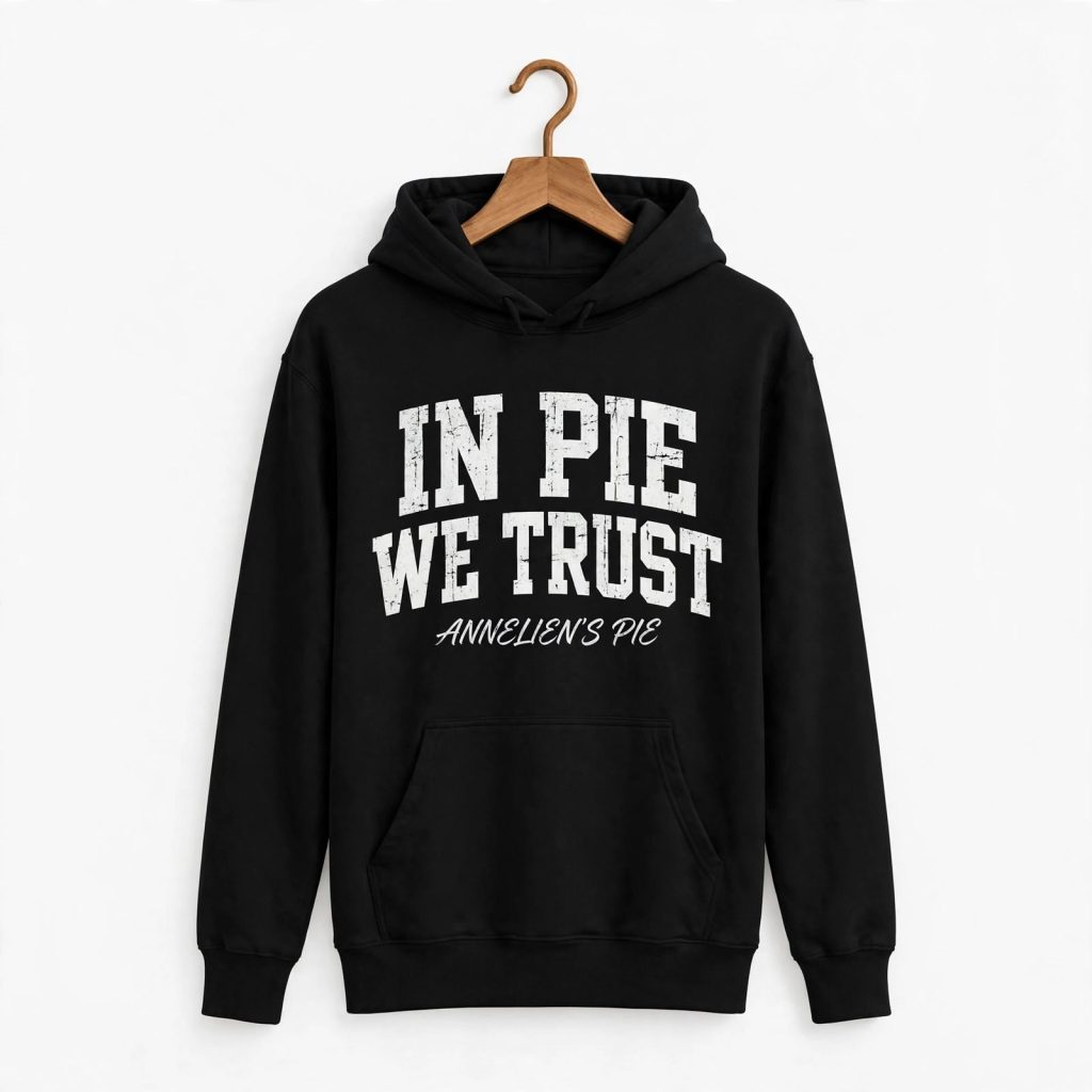 Black hoodie sweatshirt - In Pie We Trust - Annelien's Pie bakery merch - distressed white vintage varsity lettering on black pullover hoodie